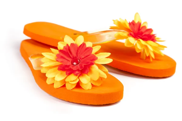 Orange flip-flops with flowers — Stock Photo, Image