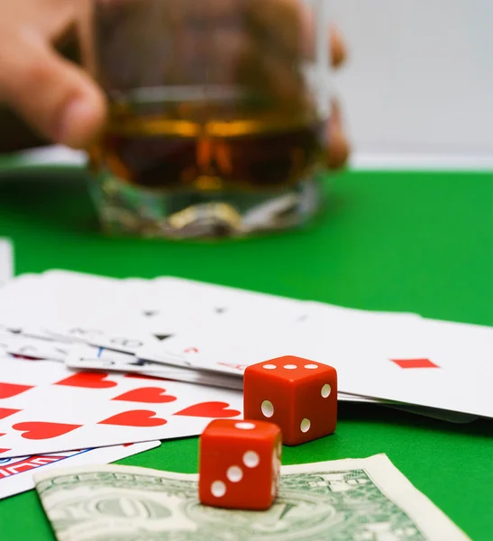 Stock image Red dice and playing cards on a casino table