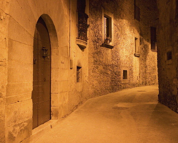 European Historic Alley At Night With Yellow Street Lamps