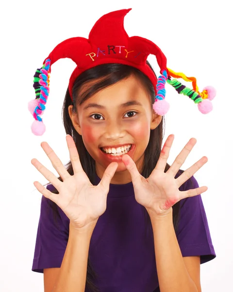 Skrattande flicka med en joker hatt — Stockfoto