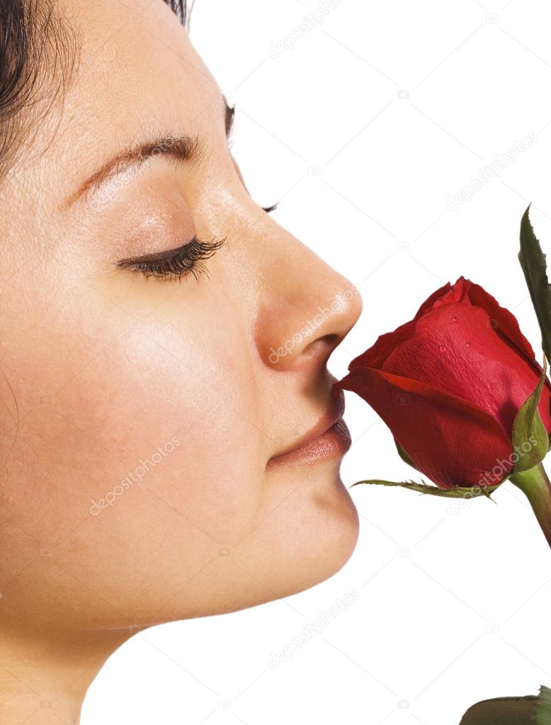 A girl smelling a rose from her lover