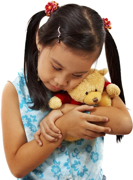 Mladá dívka milující a drží její medvídek — Stock fotografie
