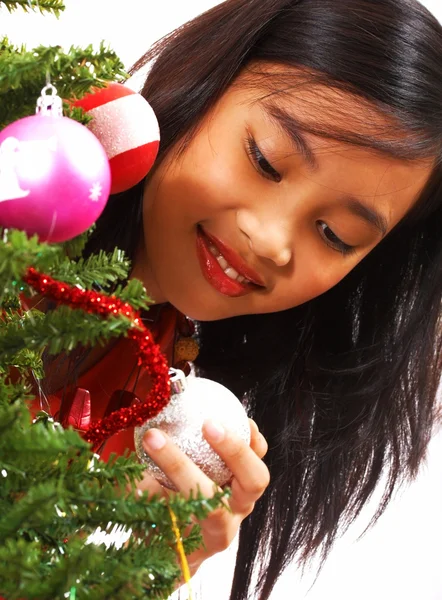 Girl Adding Balls To A Christmas Tree — Stock Photo, Image