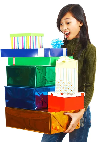 Dziewczyna otrzymujący stos prezentów — Zdjęcie stockowe