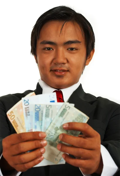 Empresário sorridente Segurando Euros — Fotografia de Stock