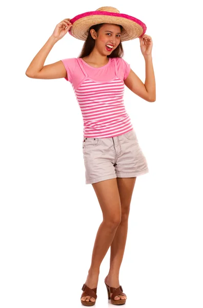 Flicka klädd i fashionabla shorts och rosa t-shirt — Stockfoto