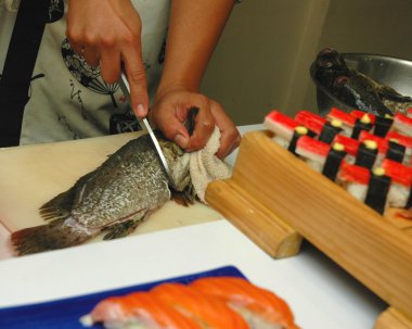 Japanese Restaurant Cutting Fish For Sushi clipart