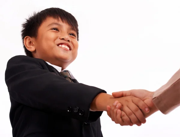 Rapaz formal agitando as mãos com um adulto — Fotografia de Stock