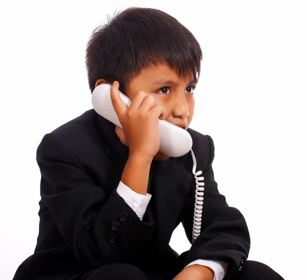 Νεαρό αγόρι σε ένα σταθερό τηλέφωνο — Φωτογραφία Αρχείου