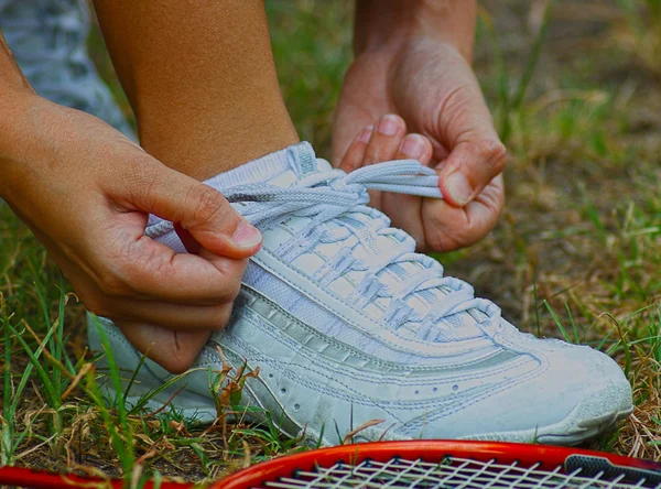 Tying Shoes Ready For A Game Of Badminton — Stock Photo, Image