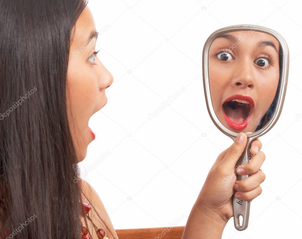 Girl Surprised At Looking In The Mirror