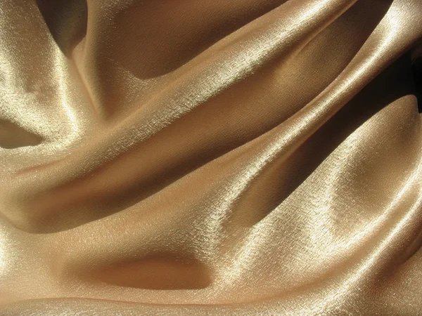 Draped gold satin background — Stock Photo, Image