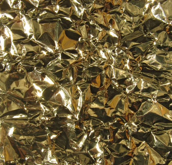 Gold metal background - crumpled foil — Stock Photo, Image