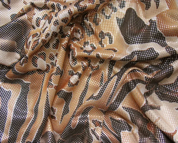 Draped brown multicolored fabric with spangles — Stock Photo, Image
