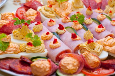 Traditional food made out of ham eggs and paste with vegetable clipart