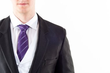 Young buisnessman with purple tie on white background clipart