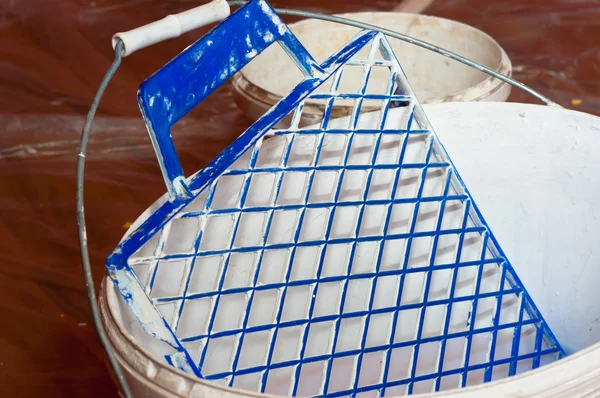 Paint bucket with painting accessorie — Stock Photo, Image