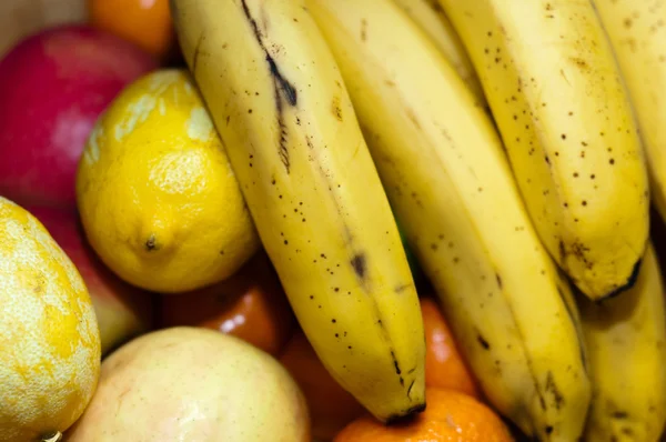 stock image Fresh fruits closeup with banana lime orange and apple