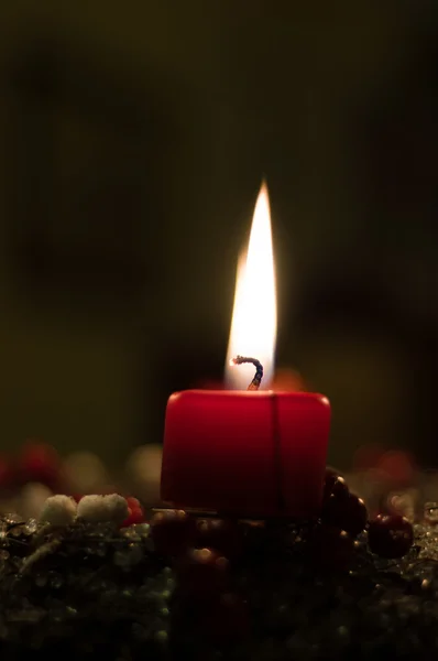 Christmas candle on girlde with blurry background — Stock Photo, Image