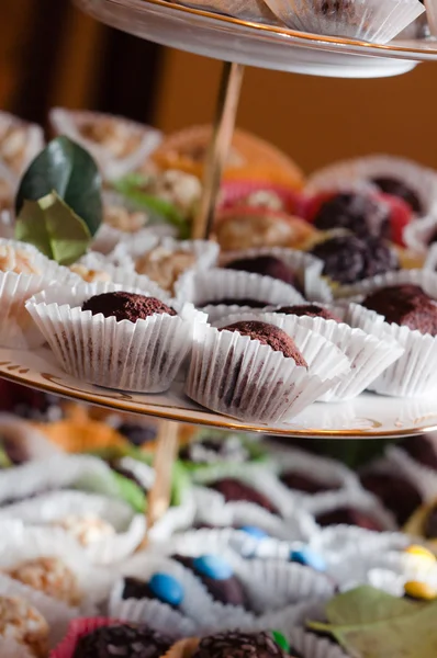 A plate of chocolates with other treats — Stock Photo, Image