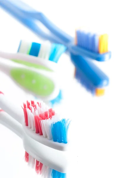Closeup colorful toothbrush on a white background — Stock Photo, Image