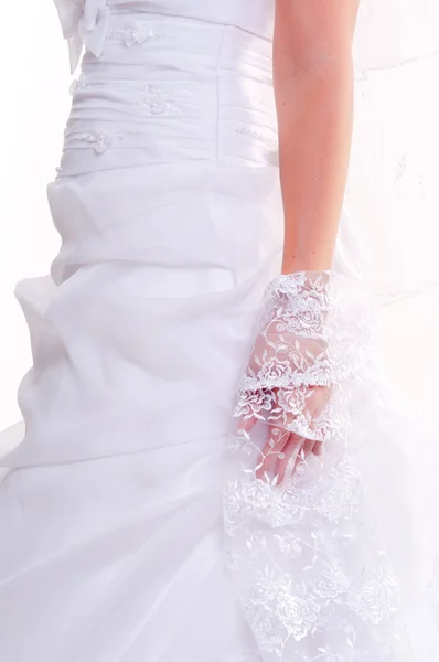 Deel van een meisje in mooie bruiloft jurk — Stockfoto