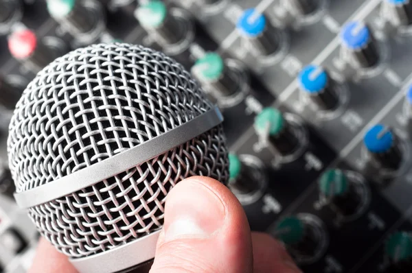Sound mixer with microphone and hand — Stock Photo, Image