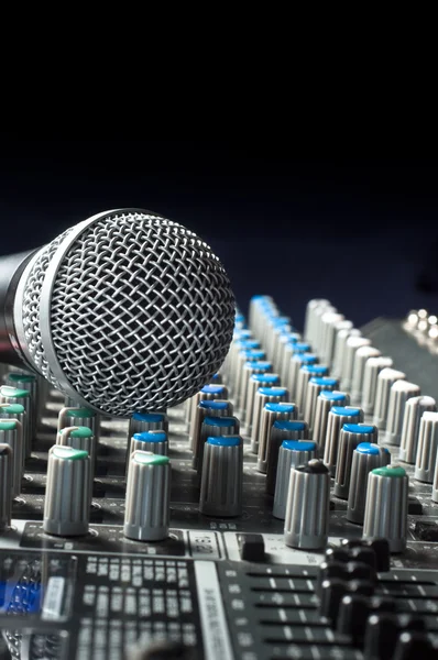 Part of an audio sound mixer with a michrophone — Stock Photo, Image