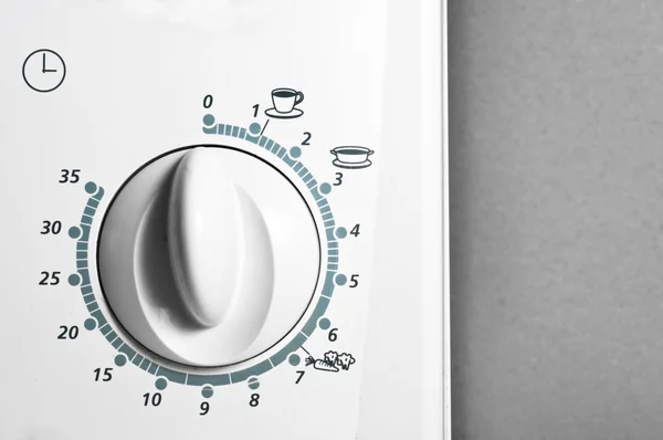Botão de um forno de microonda com símbolos nele — Fotografia de Stock
