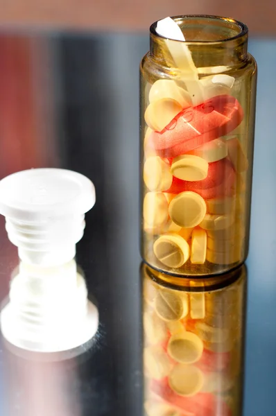 Opened medicine bottle with reflection — Stock Photo, Image