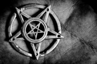 Pentagram in hand macro shot clipart