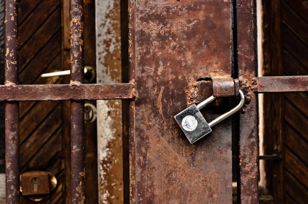 Old rusty padlock on cell door — Stock Photo, Image