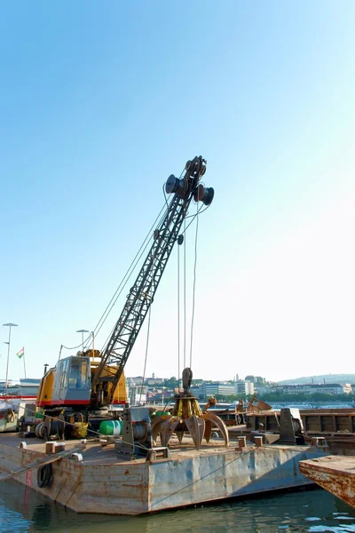 A big crane on boats in a construction — Stock Photo, Image