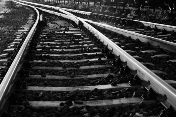 Black and white photo of some old rails — Stock Photo, Image