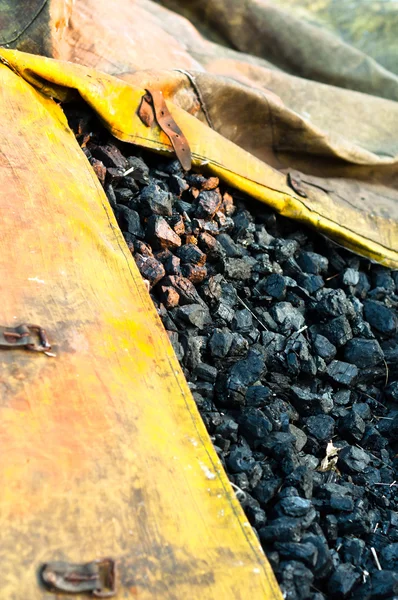 Big stack of industrial coal in yellow sack — Stock Photo, Image