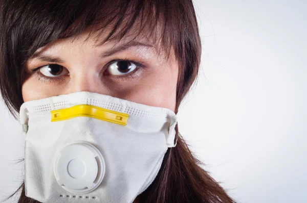 Girl wearing protective mask against white background — Stock Photo, Image