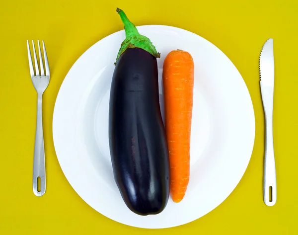 stock image Eggplant and carrot on a white plate