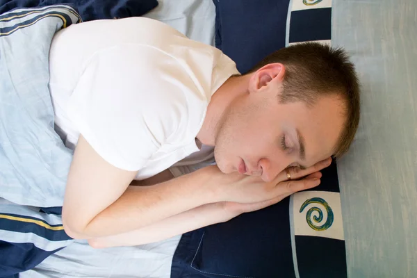 Stock image Man comfortably sleeping in his bed