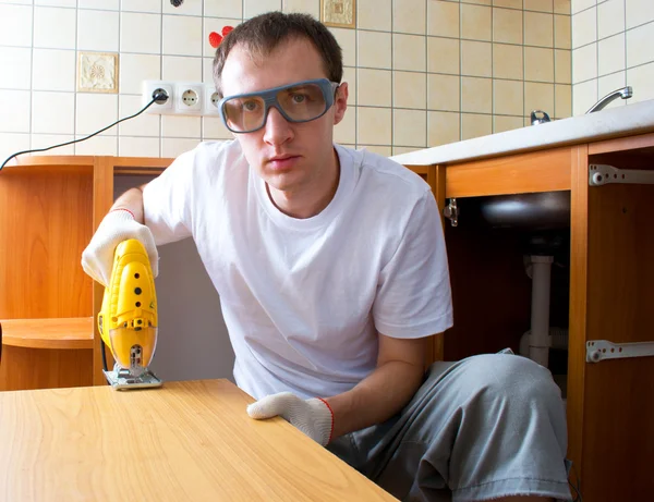 stock image The man with an electrofret saw