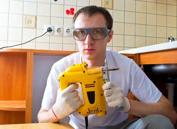 stock image The man with an electro fret saw