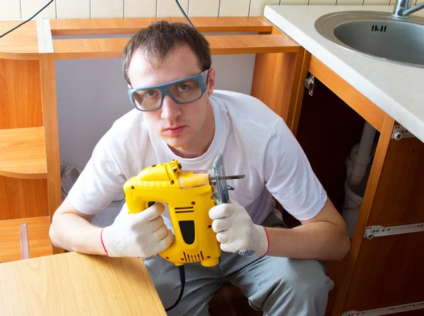 stock image The man with an electro fret saw