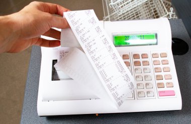 Close-up image of a shop-assistant's hand pressing a key of an e clipart