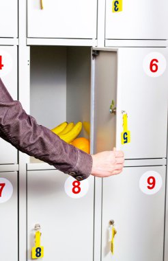 Hand with bananas in the safe clipart