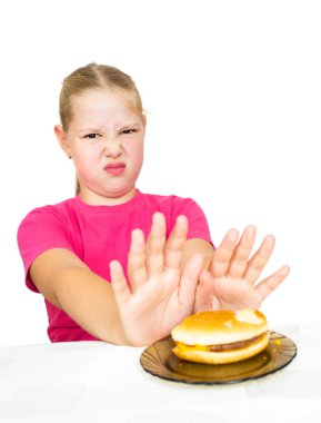 Girl refuses hamburger isolated on white clipart