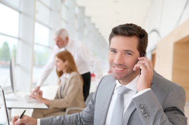 Businessman talking on the phone clipart