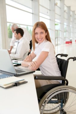 Handicapped woman in office clipart