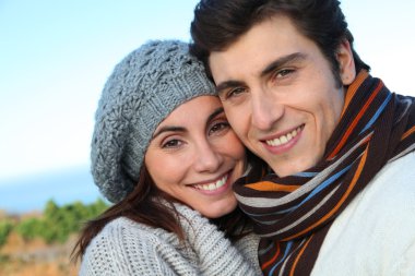 Portrait of happy couple in fall season clipart