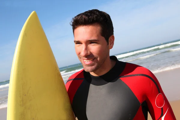 Portrait of young man with surfboard — Stock Photo, Image