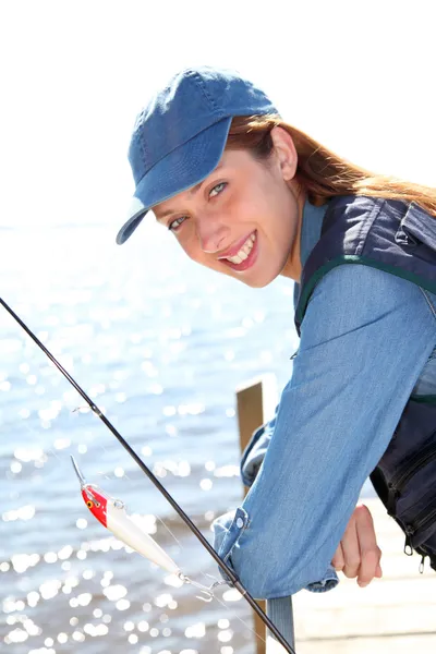 Portrait of woman with fishing rod — Stock Photo, Image