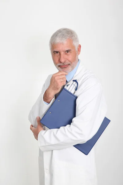Senior doctor with hand on chin — Stock Photo, Image